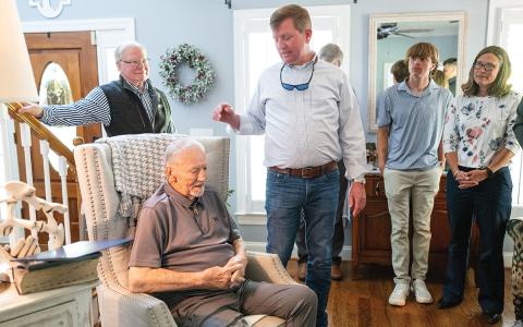 Demorest Mayor Jerry Harkness honors John Popham at his home on Thursday, April 9. Popham served the city of Demorest for 44 years and helped establish the city’s water system. Also pictured are Care Pastor Tom Skipper (left) and John’s grandson Asa Popham and daughter-in-law Kim Popham (right). (Zach Taylor/Staff)