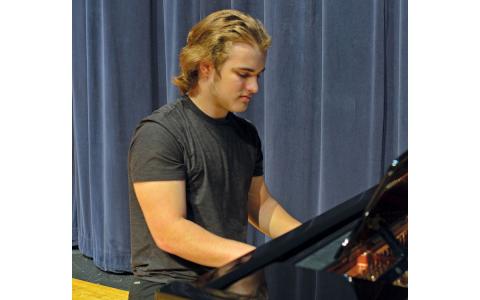 Terrell Miller of The Blue Room Boys plays the piano. (Callie Cueva/Staff)