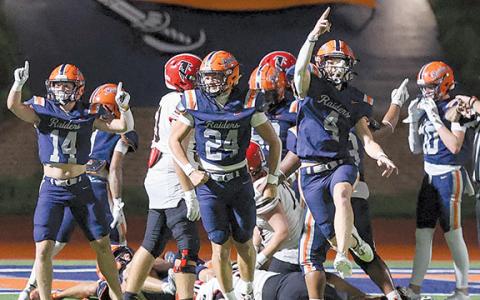 Habersham Central defenders Sawyer Burgess (14), Noah Harkins (24) and Parks York (4) celebrate a fumble during the game between Flowery Branch and Habersham Central at Raider Stadium on Friday, Aug. 22.  (Landen Todd/Staff)