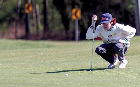 Habersham Central junior golfer Tristan Farr prepares to putt the ball. (Landen Todd/Staff)