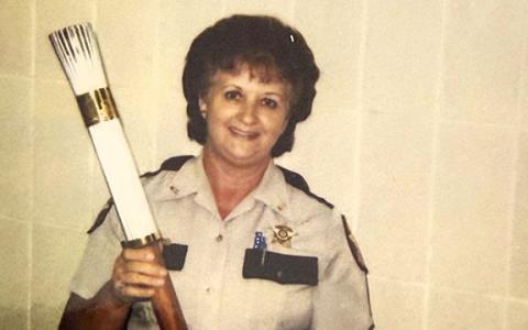 Deputy Nell Goss holds the 1996 Olympic Games Torch, which she carried during the opening ceremony. (Submitted)