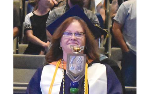 Sharon McFarland leads the processional into the auditorium at Level Grove Baptist Church during North Georgia Technical College’s commencement ceremony last year. This year’s ceremony will be held in the new Dr. Mark A. Investor Center for Living and Learning. (Samantha Sinclair/Staff)