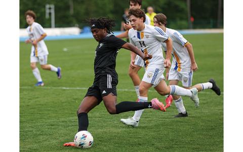 Tallulah Falls senior Versean Turnquest (11) shoots the ball during the state playoff match between Tattnall Square Academy and Tallulah Falls at Amick Field on Friday, May 8. (Landen Todd/Staff)
