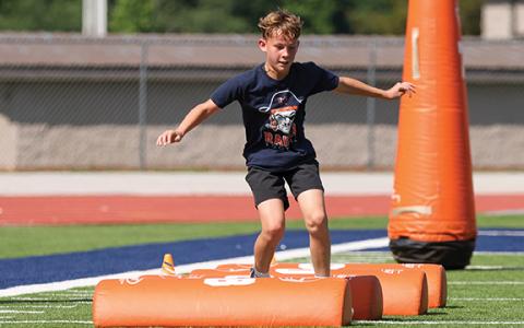 Camper Jacob Barnett shows off his skills during the HCHS football youth camp at Raider Stadium. (Landen Todd/Staff)
