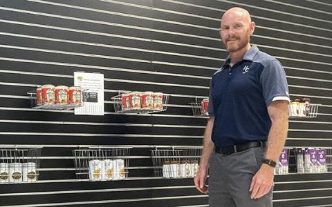 Habersham Central High School Principal Dr. Adam Bagwell stands amongst some of the offerings in the new Raider Food Mart, a food bank for all students to enjoy starting Aug. 7. (Submitted)