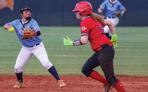 Habersham Central infielder Oaklee Jackson (5), left, throws the ball during the softball game between Stephens County and Habersham Central  at Raider Field on Monday, Aug. 3. (Landen Todd/Staff)