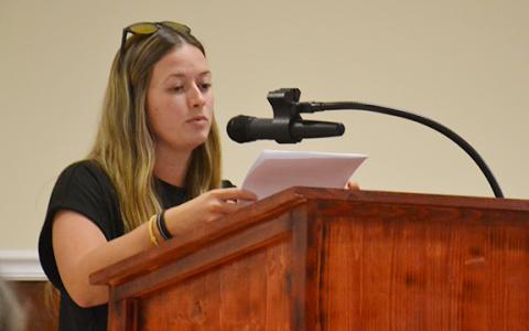 Sydney Blackburn shares her concerns about the rezoning of 45 acres from the county's Suburban Residential to Baldwin's Highway Business during a second public hearing on Cook Construction's request Tuesday night. (Samantha Sinclair/Staff)