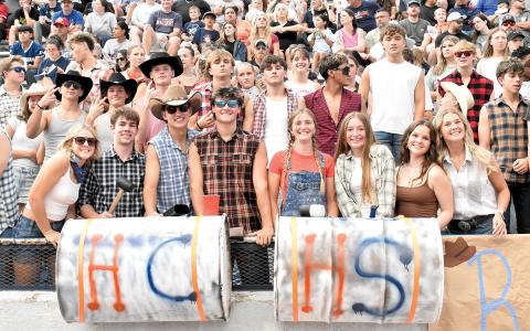 Dacie Mash, Parker Homa, Carson Crane, Ethan Wheeler, Emmie Kyle, Zoey Sosbee, Megan Eash and Kaylan Barrett and the rest of the Raider Rowdies prepare to cheer on Habersham Central as they get ready to kick off against Stephens County. (Noah Ansley/Staff)