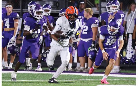 Habersham Central senior wide receiver KJ Murray (12) returns the kick off during a football game between Habersham Central and Monroe Area at the Purple Pit on Friday, Sept. 4. (Landen Todd/Staff)