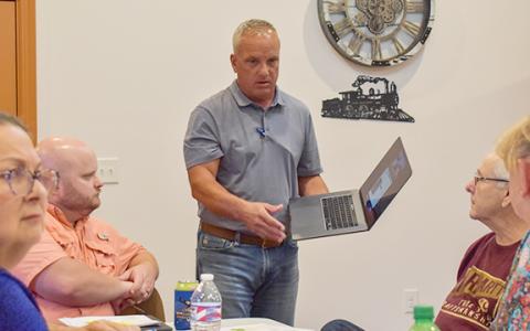 Johnny Collins, representing Hangar One Investors, shows Alto's council what the 155 S Grant St. property could look like as a storage building.  (Hannah Caudell/Staff)
