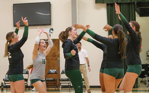 Tallulah Falls senior Shelby Whisnant (17) and her teammates celebrate after scoring a point during a volleyball match at TFS on Tuesday, Sept. 22. (Landen Todd/Staff)