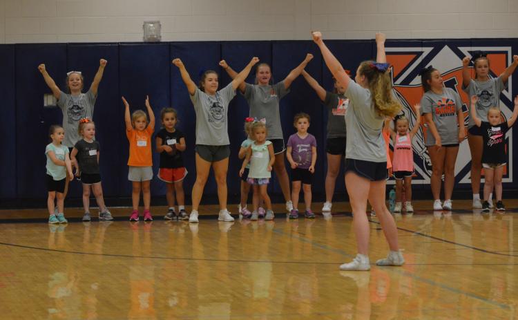 Campers perform a cheer at the beginning of the Future Lady Raiders Cheerleading Camp Tuesday.