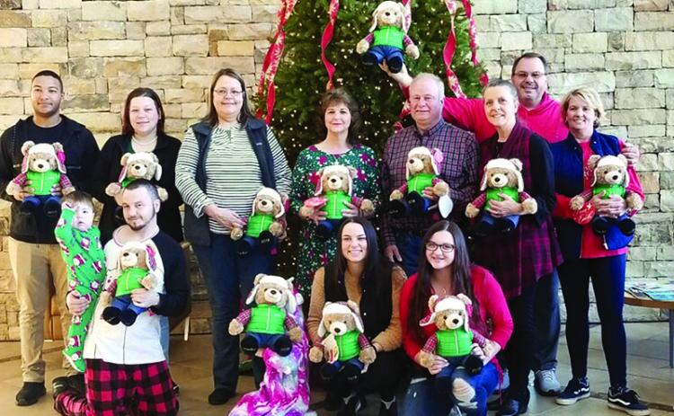 Habersham County Farm Bureau handed out Belkie Bears to patients at Habersham Medical Center as part of their Beary Merry Christmas on Wednesday morning. Participants are, back row from left, Malik Perry, Katie Peck, Julie Owens, Janet Wilbanks, Jimmy Kowalsky, Habersham County Farm Bureau president; Cheryl Kowalsky, Habersham County Women’s Committee; Tim Bryant, agency manager; and Chris Bryant. Front row are, from left, Joseph Peck with Noah, Raven Peck, Brette Bryant and Lauryn Bryant.