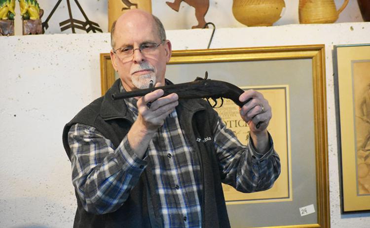 One of the many unique items auctioned off Friday at Once Upon a Time Co. in downtown Clarkesville was an “Indian used blacksmith made percussion pistol” from circa 1870.