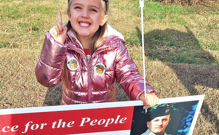 Rebekah Grace Dotson accompanied her grandparents, Glenda and Dywane Dotson of Baldwin, to the polls Tuesday in Cornelia.