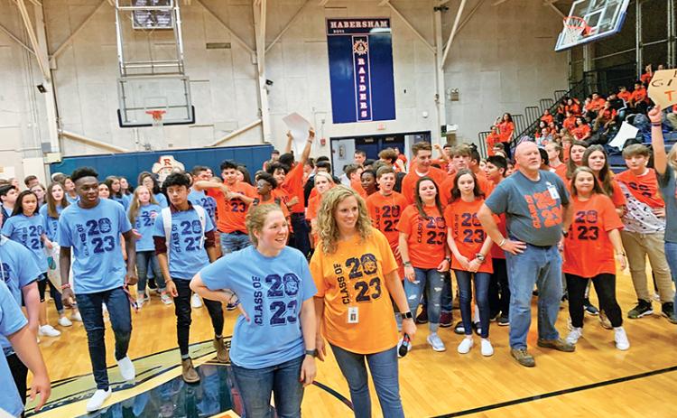 Physical education teacher Lindsay Herrin (front right) and math teacher Hannah Blalock (front left) help judge a dance competition during a Battle of the Houses at Habersham Ninth Grade Academy.