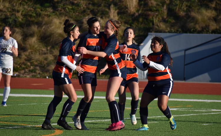 Habersham Central’s Anna LaBarbera, from left, Addie Penick, Sydney Turner, Abigail Deleon and Maria Miguel celebrate a goal from Penick during the second half of the Lady Raiders 5-2 victory over Dawson County High School Friday.