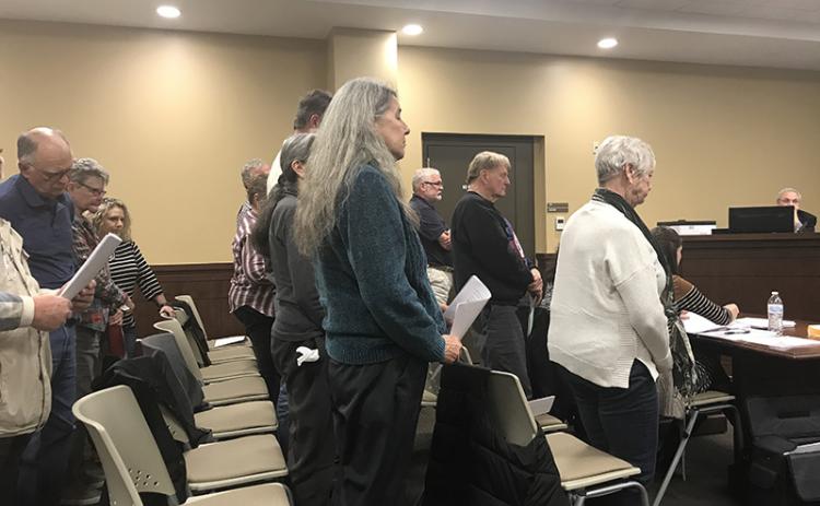 Residents of the Echota/Stonebank Road neighborhood stood in support as their petition to deny a local wedding venue from opening there was read Monday night at the Habersham County Board of Commissioners meeting.