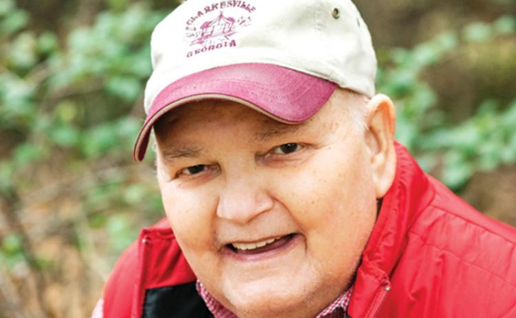 At a family photo shoot in November, Sam Tolbert wanted to have his photo made in his Clarkesville cap. “I think his smile says it all,” said longtime friend Lane Gresham.