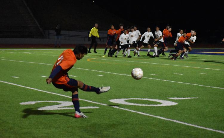 Habersham Central's Yobani Alvarez sends a free kick into the box during the Raiders' 2-1 loss to Lanier High School Friday.