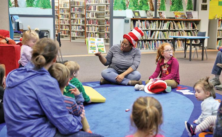 Clarkesville Library hosted a Dr. Suess celebration as the world famous children’s author’s birthday was March 2. Children gathered for arts and crafts activities and reading Thursday. Youth Services Specialist Ashawna Green, children and parents gather for story time.