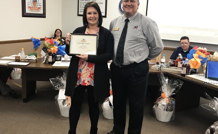 The Habersham County Board of Education Extra Mile Award for March went to counselor Natalie Ziemba of the Habersham Success Academy. Ziemba was instrumental in planning a life skills day – also called “Adulting Day” – for her students, which taught them everything from cooking to car maintenance to sewing and financial planning. Ziemba recruited volunteers and presenters to teach the kids the skills they said were lacking in the normal curriculum. Ziemba got her award from board member Doug Westmoreland.
