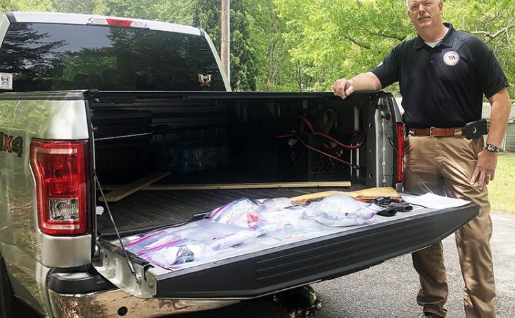 Habersham County Sheriff Joey Terrell shows off some of the seized drugs from a raid in Alto on Wednesday.