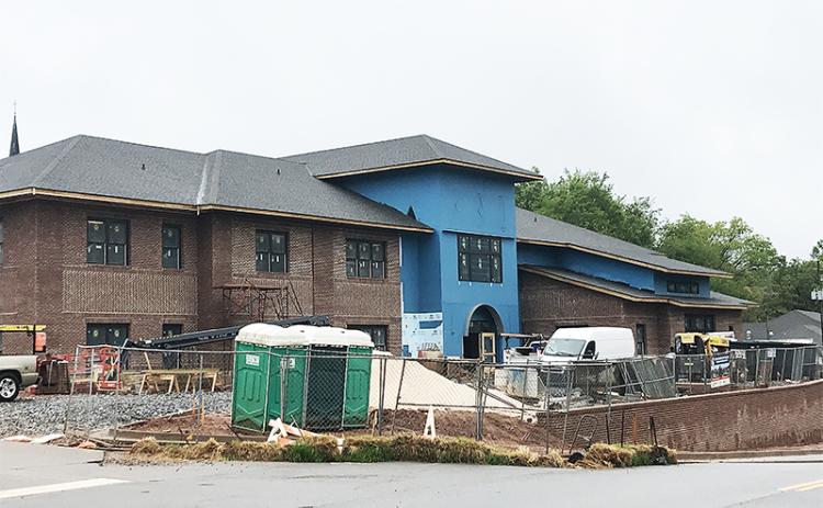 The new Cornelia administration building is scheduled to be open by the end of May, but bad weather has slowed the outdoor portions of the construction, City Manager Donald Anderson said Thursday.