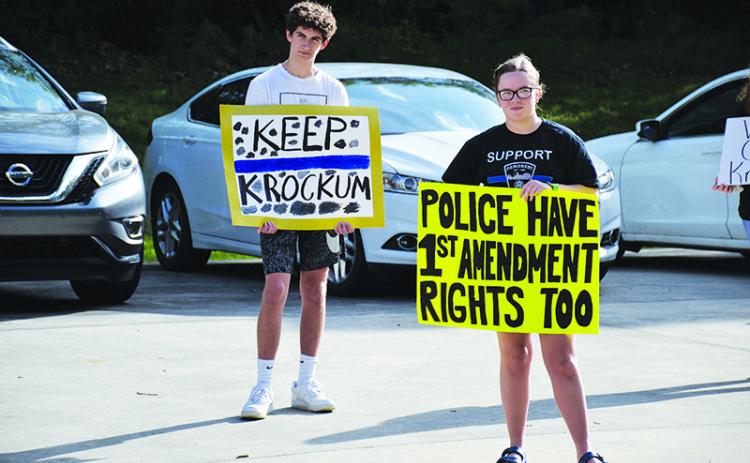 Tucker Demore and Saylor Krockum were among many in the Demorest City Hall parking lot Tuesday hoping to hear from the City Council.