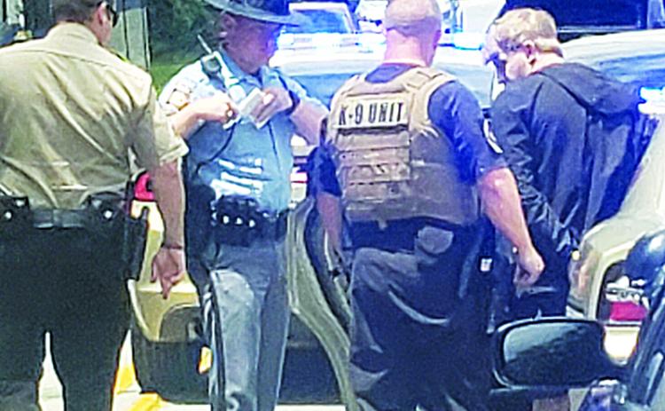 Habersham County Sheriff’s deputies arrest Blake Belback after a high-speed chase ended on Duncan Bridge Road. Photo by ALAN NESMITH