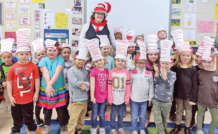 Deana Snowden celebrates the legacy of Dr. Seuss with her Demorest Elementary pre-K students earlier this school year.