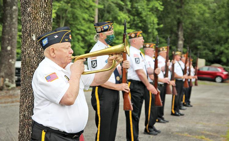 Woodrow Free plays Taps following the three-round valley at the Memorial Day ceremony.