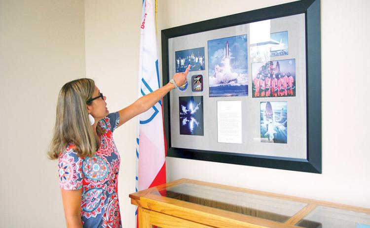 Tallulah Falls School Upper School Academic Dean Kim Popham observes the many keepsakes reminiscing when students and faculty won the opportunity to travel to the White House.