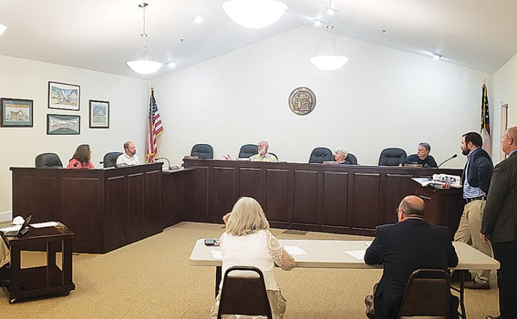 Clarkesville City Council discusses a presentation by Cornelia Mayor John Borrow on Monday night.