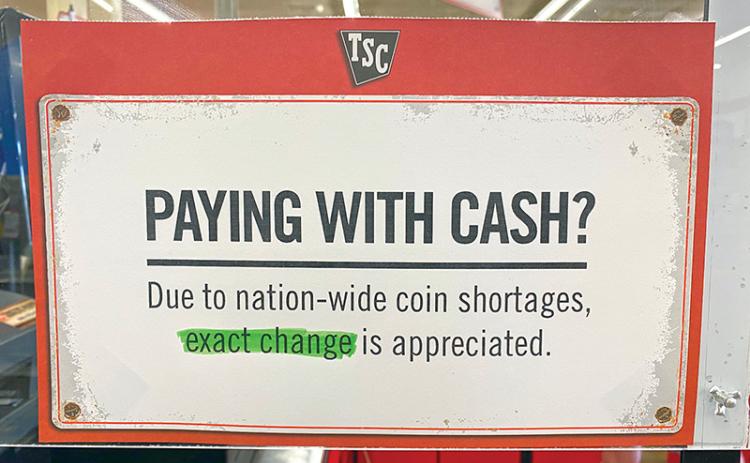 A sign at Tractor Supply in Cornelia lets folks know they are short on change.