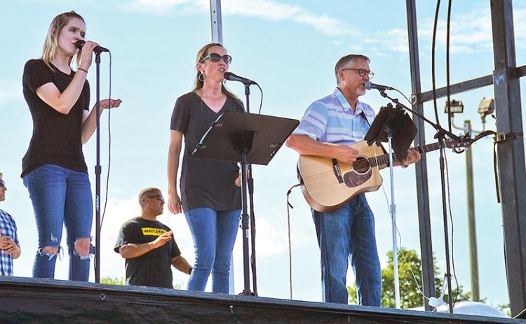 Salem Dover, Alice Dover and Alan Baker perform at Sunday's prayer meeting at Habersham Ninth Grade Academy.