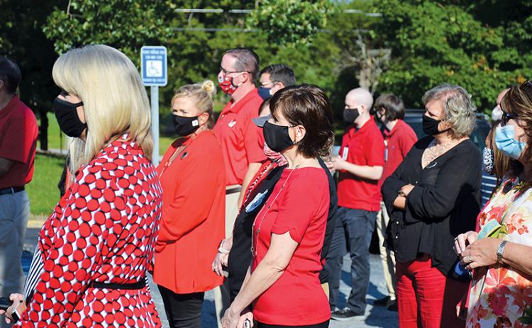 Students and staff members at North Georgia Technical College dressed in red and Black Tuesday morning and said a prayer for college president Dr. Mark Ivester, who has been hospitalized with complications due to COVID-19.
