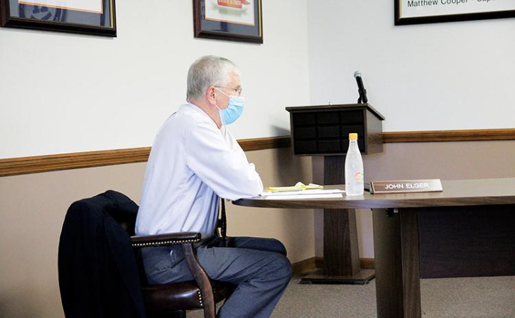 School board member John Elger has taken extreme precautions to slow spread of COVID-19, but ended up testing positive anyway.