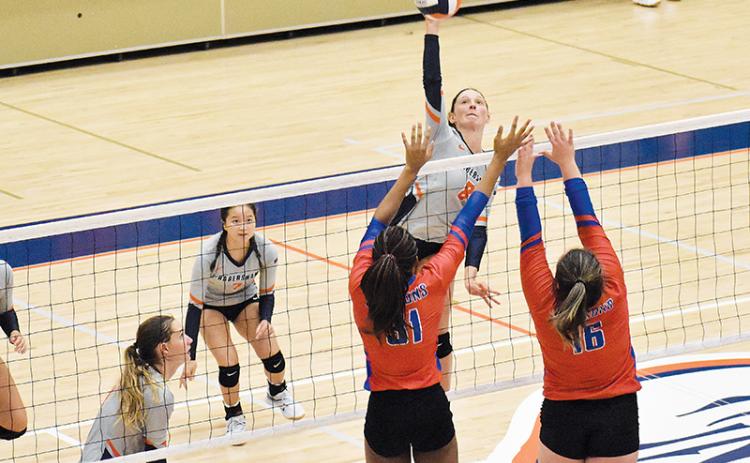 Habersham Central’s Madeline Koshuta looks to power the ball past two Jefferson blockers on Thursday night.