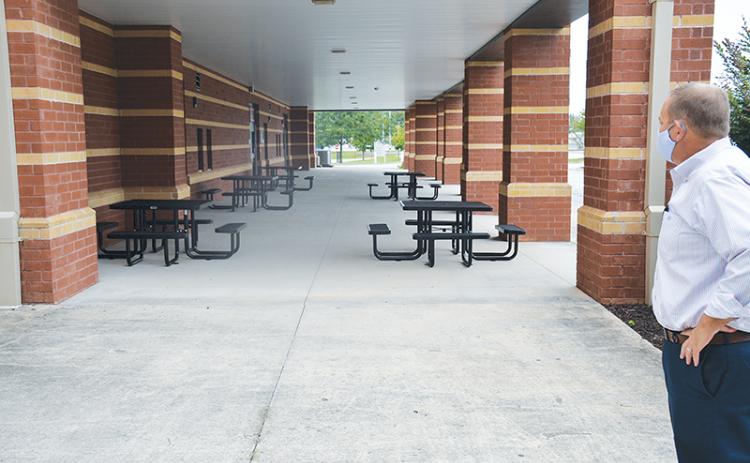 Habersham Central Principal Jonathan Stribling overlooks one of his school’s new outdoor classroom spaces, prompted by the need to social distance when schools reopen Tuesday, Sept. 8.