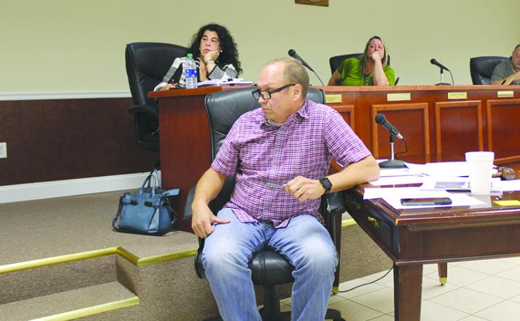 Baldwin Mayor Joe Elam listens to comments at Monday’s meeting of the city council.