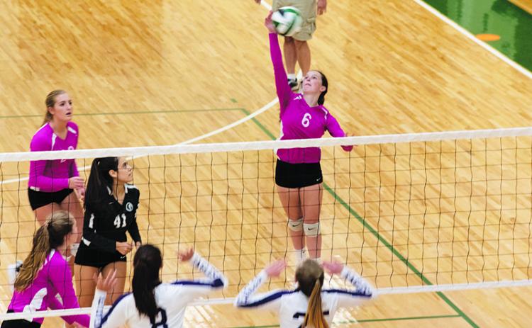 Tallulah Falls’ Sarah Jennings goes for a spike during a recent home match. BRIAN CARTER/Special