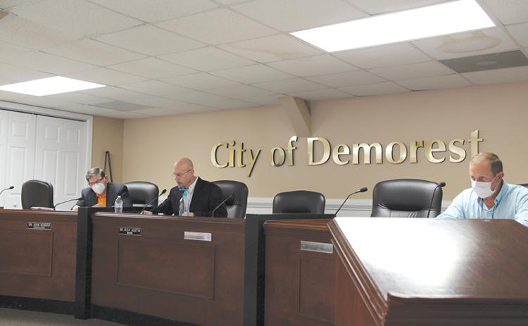 Councilman John Hendrix, Mayor Rick Austin and Councilman Nathan Davis conduct business at the Tuesday night meeting.