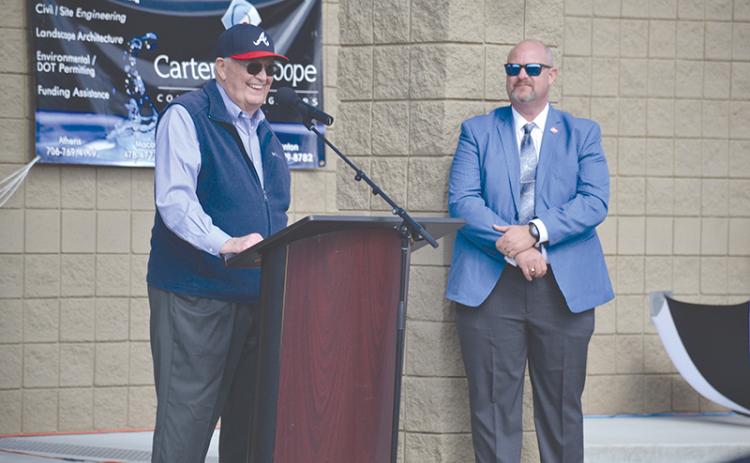 Former Georgia Sen. John Foster (left) smiles after Cornelia dedicated its new water plant to him during a ceremony Monday. Cornelia City Manager Dee Anderson made the introduction.
