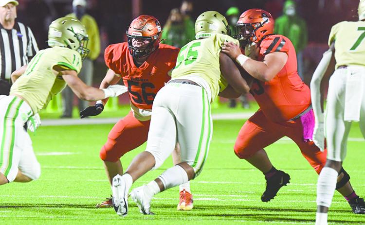 The Raiders’ running game revolves around three good backs behind a strong offensive line that includes Butch Cassidy (56) and Ethan Tomlin (53). TOM ASKEW/Staff