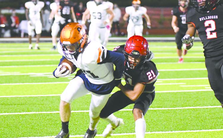 Habersham Central’s Austin Wood looks to break free of Winder-Barrow’s Alex Cha during Friday night’s game. TOM ASKEW/Special