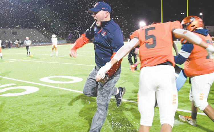 Habersham Central coach Benji Harrison celebrates after having Gatorade poured on him following the Raiders' win over Lanier. TOM ASKEW/Special