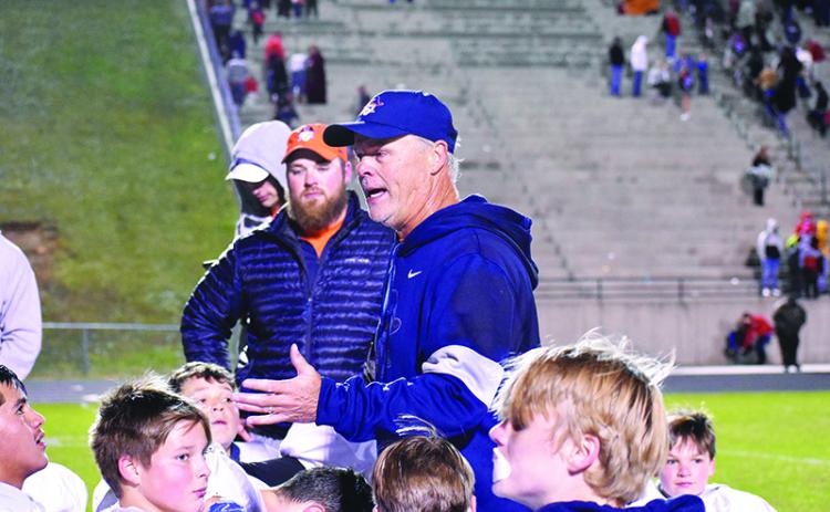 Habersham middle school football coach Mark Ausburn talks with his team after winning the league championship on Nov. 2.