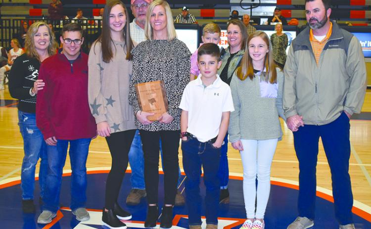 Christy Keef was joined Friday night during her induction by (front row, from left) Tammy Harris; children Carlin Fricks, Camryn Fricks, Kyler Keef and Katie Keef; and husband Dan Keef. In back are (from left) Alex Harris, Garrison Stamey and Valerie Stamey.