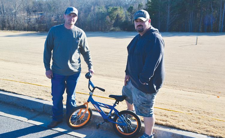 Jarrod Seabolt (left) and Mikel Bramblett have provided 26 repaired bicycles to children this Christmas as part of Drug Court’s requirements to give back to the community, but they plan to keep giving beyond completion of the program.